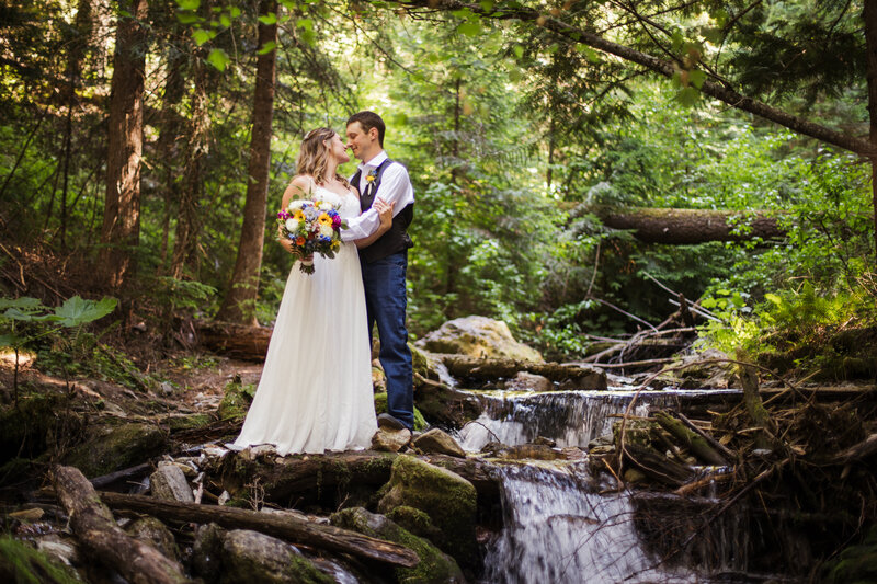 bride and groom in forest during outdoor bridals