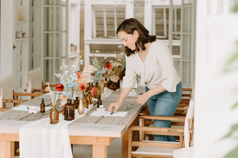 Woman setting a table for a workshop