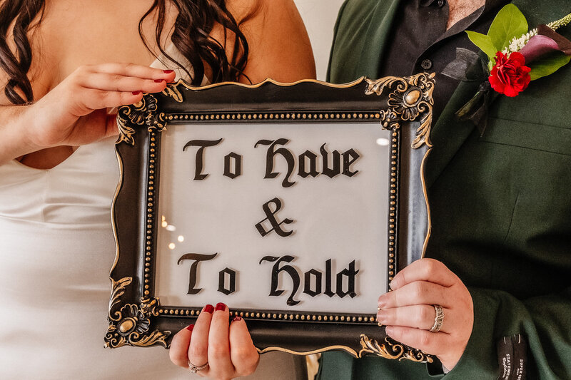 Decorative sign with couple quote for wedding