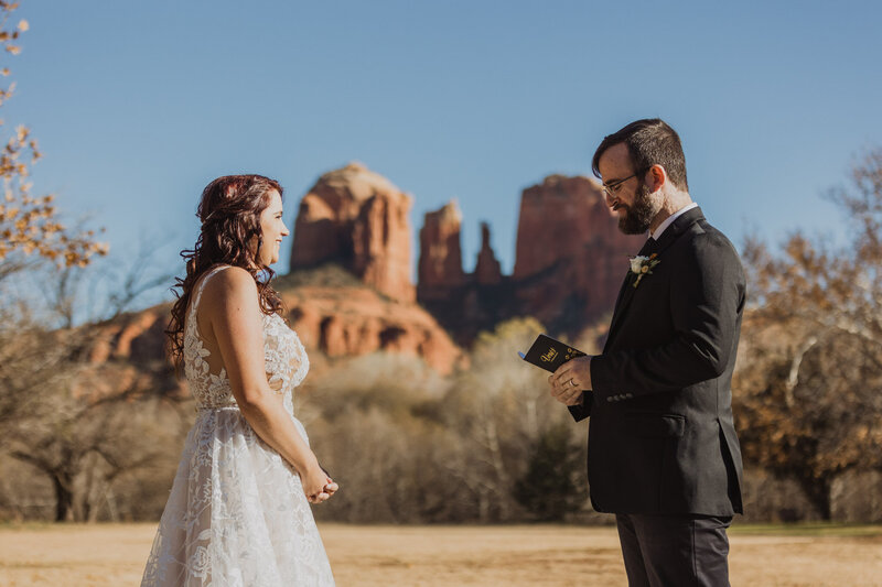 bride and groom reading vows  in sedona