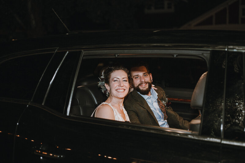 bride and groom in car