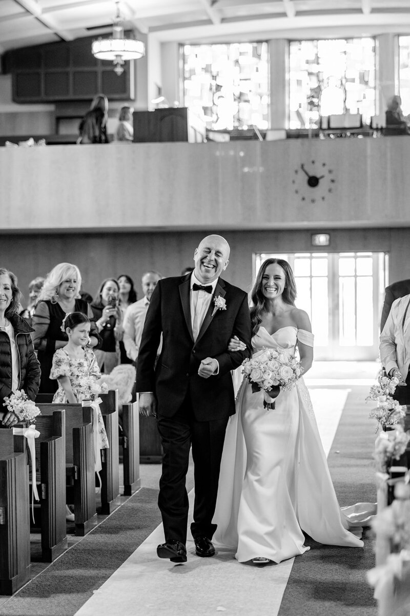 bride walking down the church aisle chicago wedding 