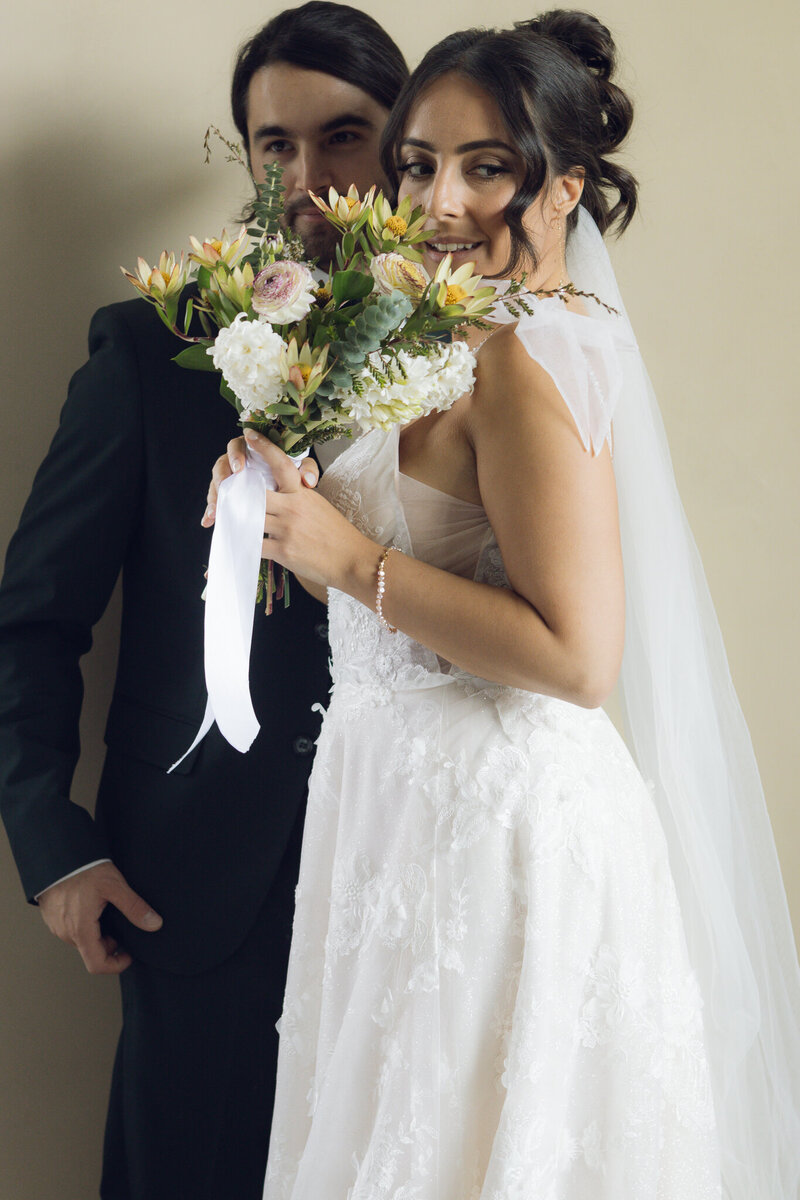 Vintage-inspired wedding rings delicately placed on handwritten vows, adding a sentimental touch to an intimate elopement.