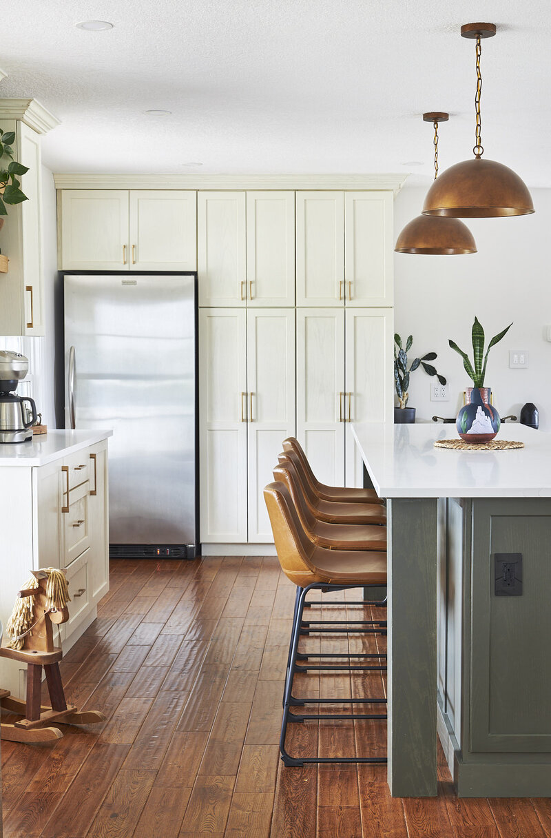 Newly renovated white kitchen  with a green island