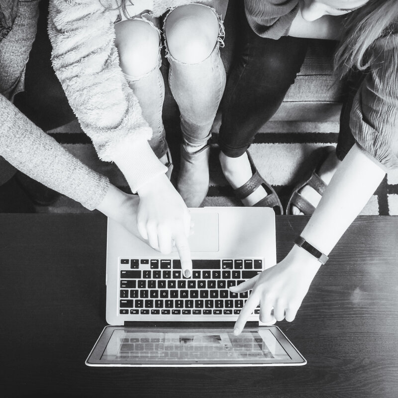 women collaborating on website business