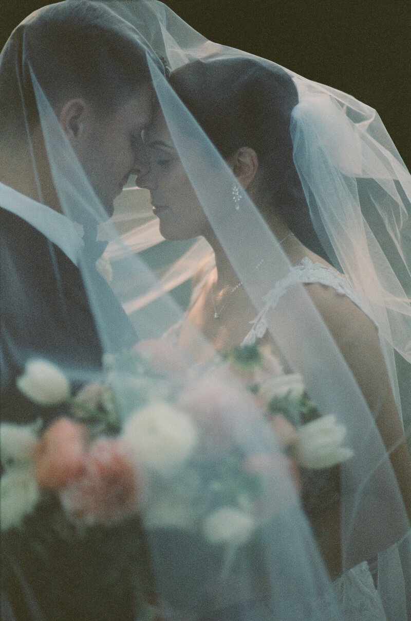 intimat moment under a veil  shot on film with a vintage feel