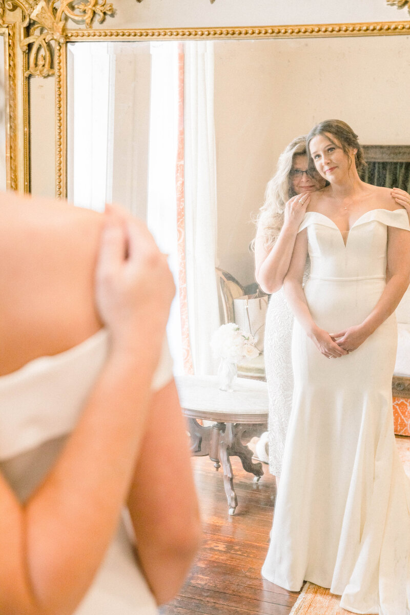 bride getting ready with her mother