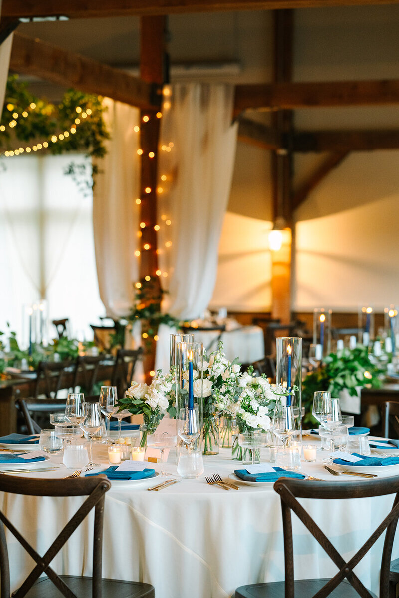Floral bouquet sitting on top of books at New England Wedding