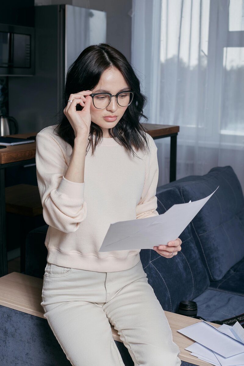 A woman inspecting a receipt