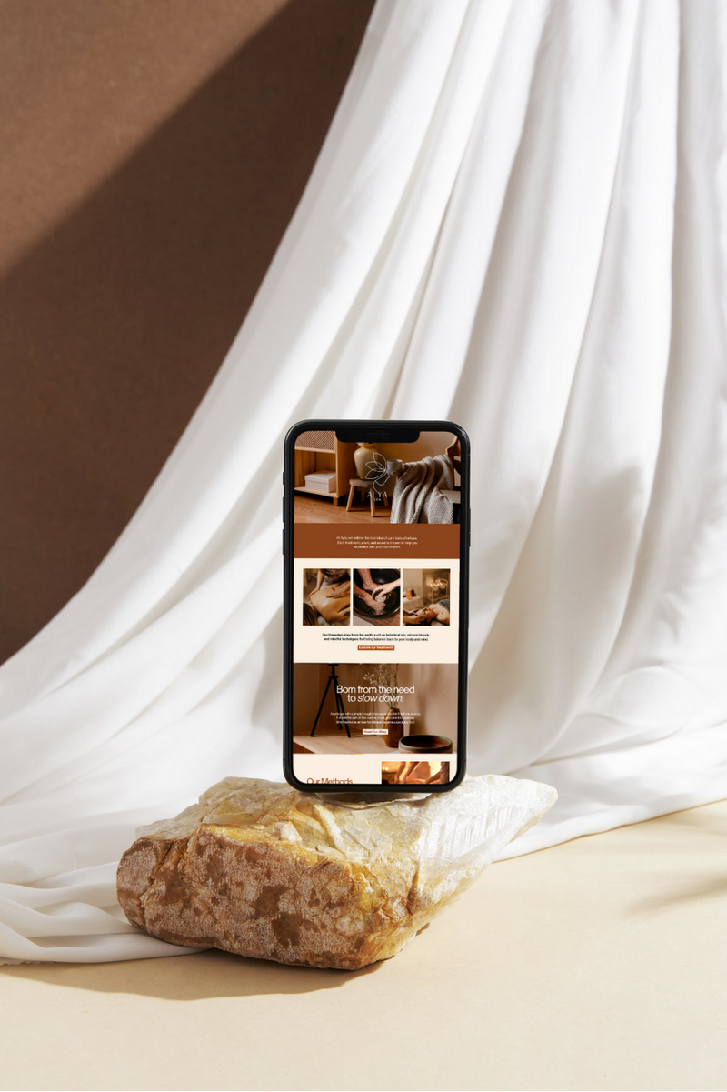 black podcast mic sitting on desk with women working