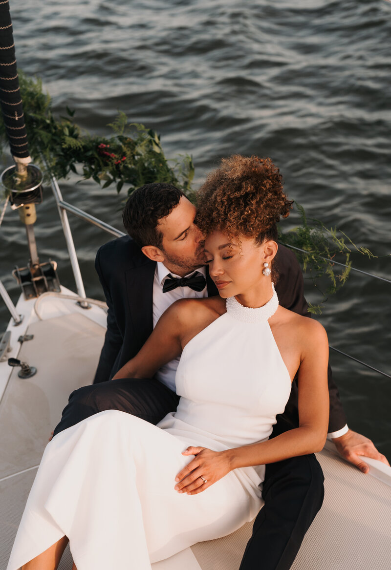A bride and groom on a sailboat getting married in south carolina.