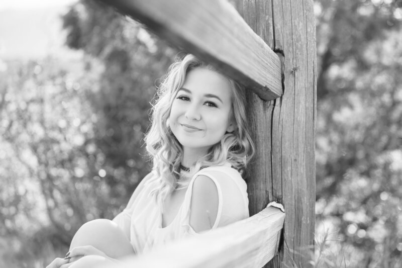 Girl smiling through fence for Orlando Graduation Photo