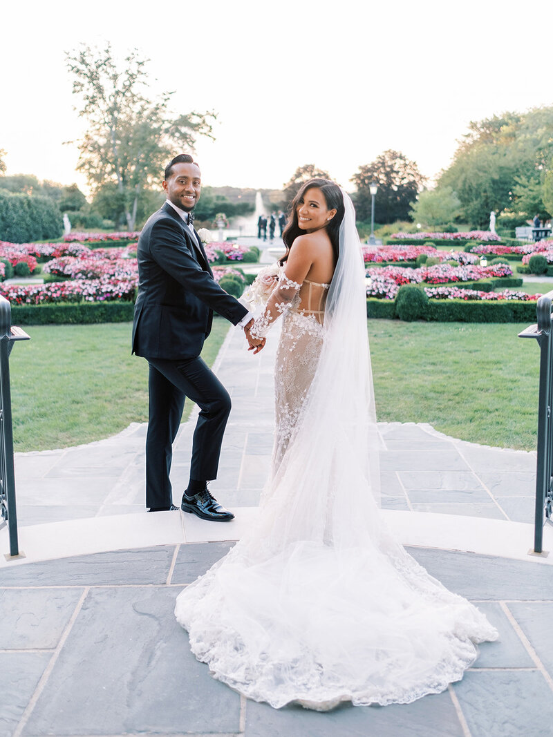 Fashionable and stylish black tie spring wedding with white roses and orchids, Berta wedding gown, and YSL bridal shoes at an Estate with French-inspired architecture and ambiance | Park Chateau Estate and Gardens | East Brunswick NJ | Denise Marie Photography | Editorial Wedding Photographer based in Philadelphia PA