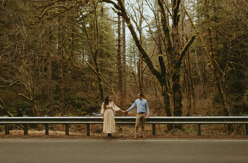 Emily-Noelle-Photography-Oregon-Elopement-Photographer-couple-holding-hands-in-front-of-guardrail