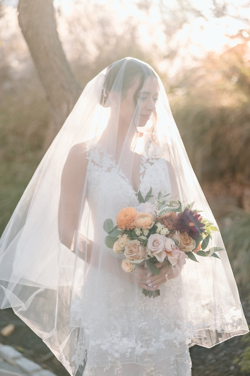 bride smiling with flowers in her hair