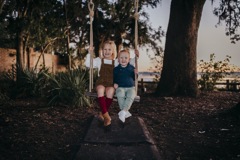 two kids on a swing at old town bluffton family session