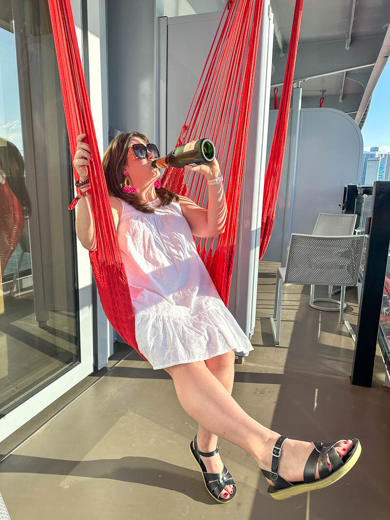 mallory drinking on a hammock viring voyages