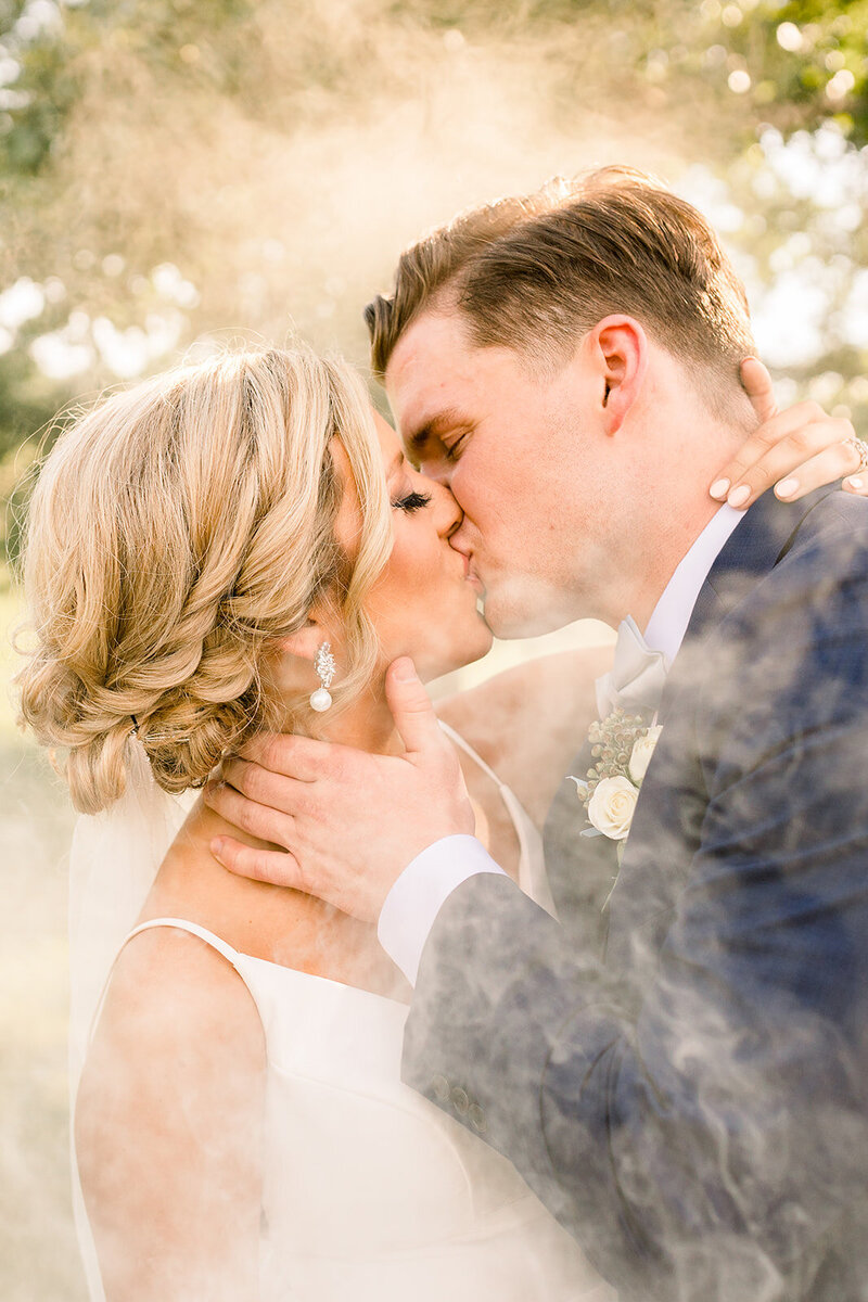 Bride and groom close up image with smoke bombs as photography effect by Lauren Haley Photographry