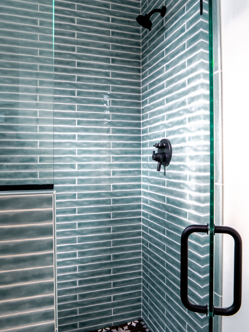 blue tile shower in a modern farmhouse