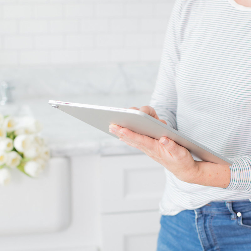 a woman working on her ipad