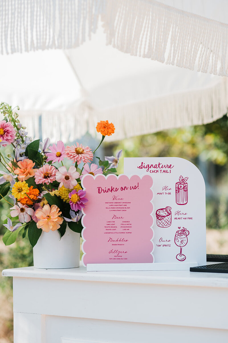 Bride wearing modern white gown with sheer polka dot bow sleeve detail. Styled by Eventive Designs in Austin, Texas.