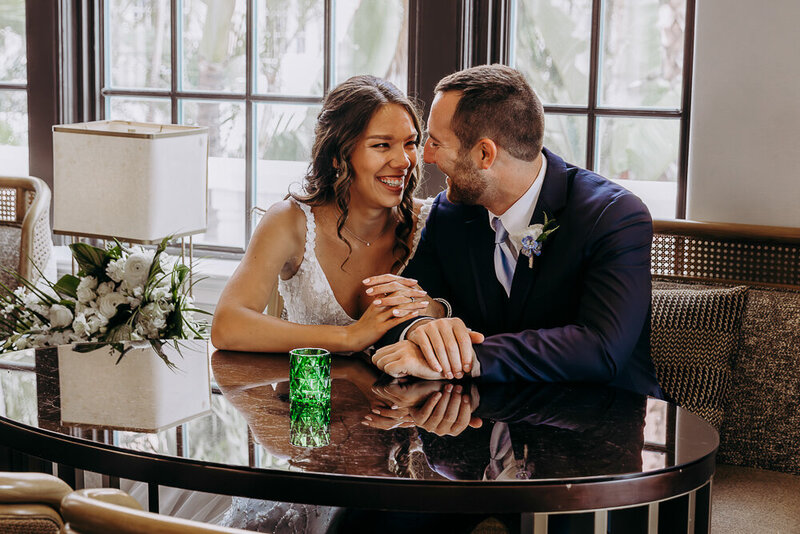 couple popping champagne after their tampa elopement