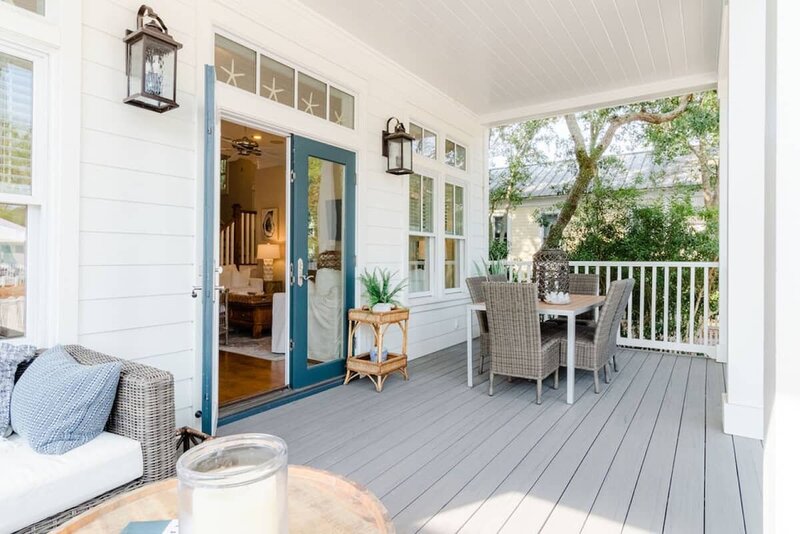 patio with blue door and outdoor seating