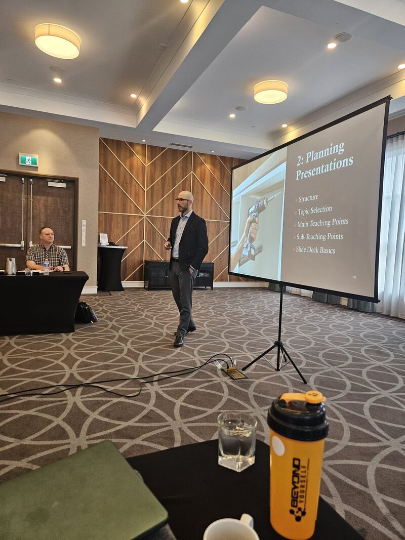 Facilitator presenting a professional development workshop focused on communication and team performance