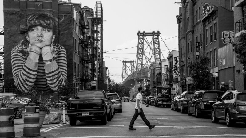 Black and white photo of brooklyn bridge and street art