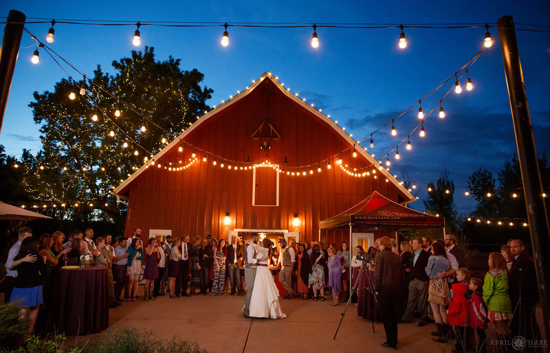 Dancing on the patio next to red barn at Denver Botanic Gardens Chatfield Farms