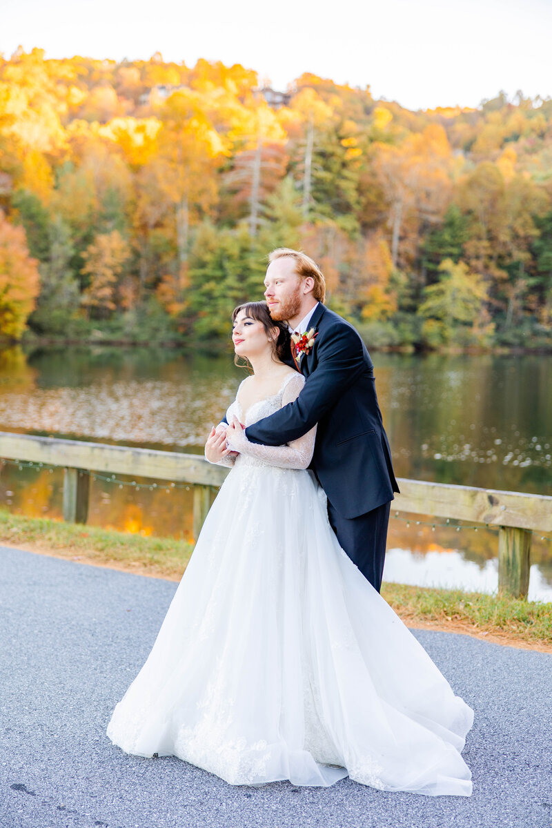 couple holding each other with fall mountain colors in the background