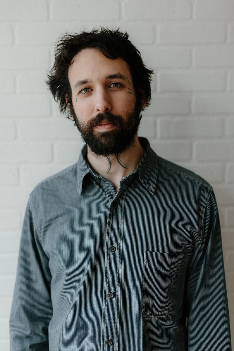 A portrait of the photographer Macaulay Lerman in his Burlington Vermont based studio