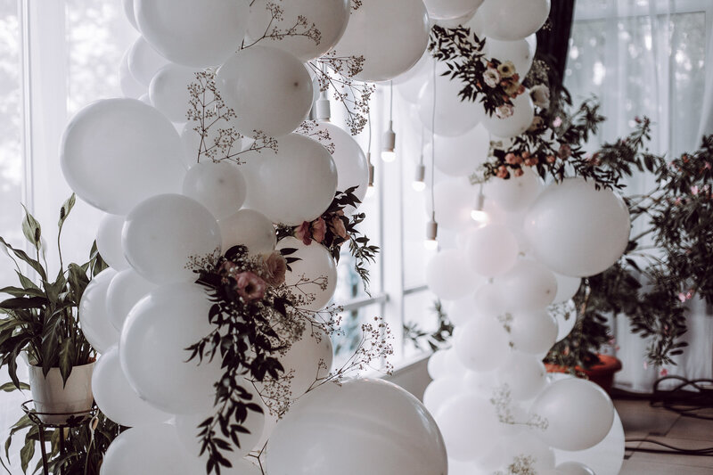 Event backdrop of balloons and florals