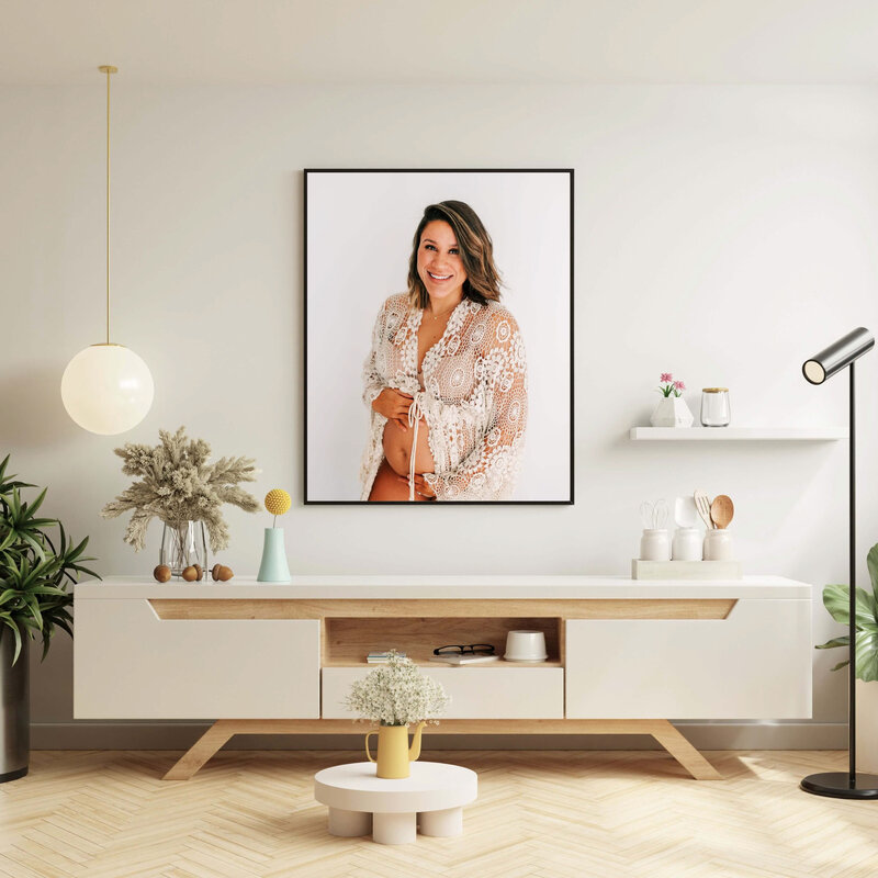 Joplin Missouri maternity photographer captures framed maternity photo of pregnant mom in crochet robe over dresser