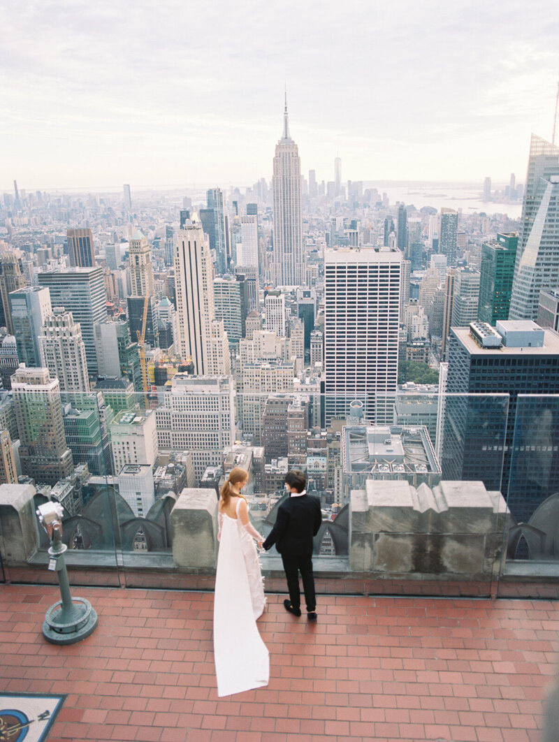 Bride and groom stepping out of an elegant New York City venue captured by Stephanie Michelle Photography, luxury wedding photographer in Dallas and NYC.