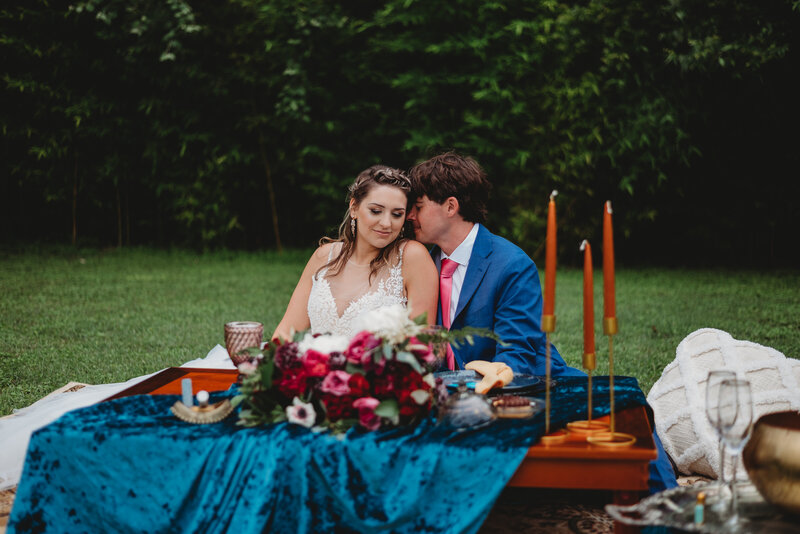 Bride and groom cuddling
