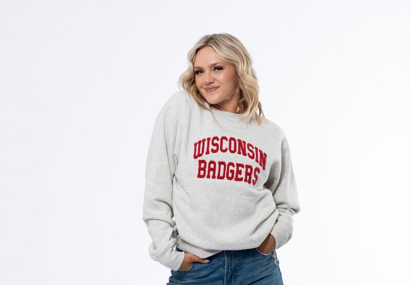 white crewneck sweatshirt with college name across chest