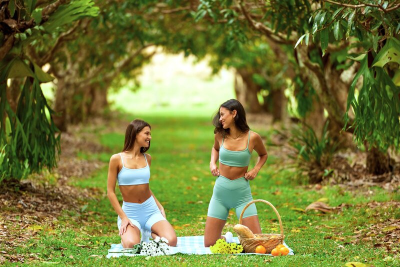 Colourful activewear photoshoot in fruit orchid on farm