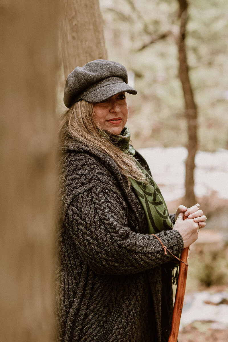 woman standing in forest 