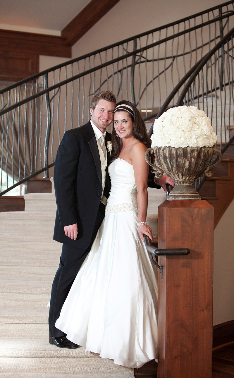 Dramatic curved staircase photo of bride and groom at Cielo at Castle Pines in Colorado