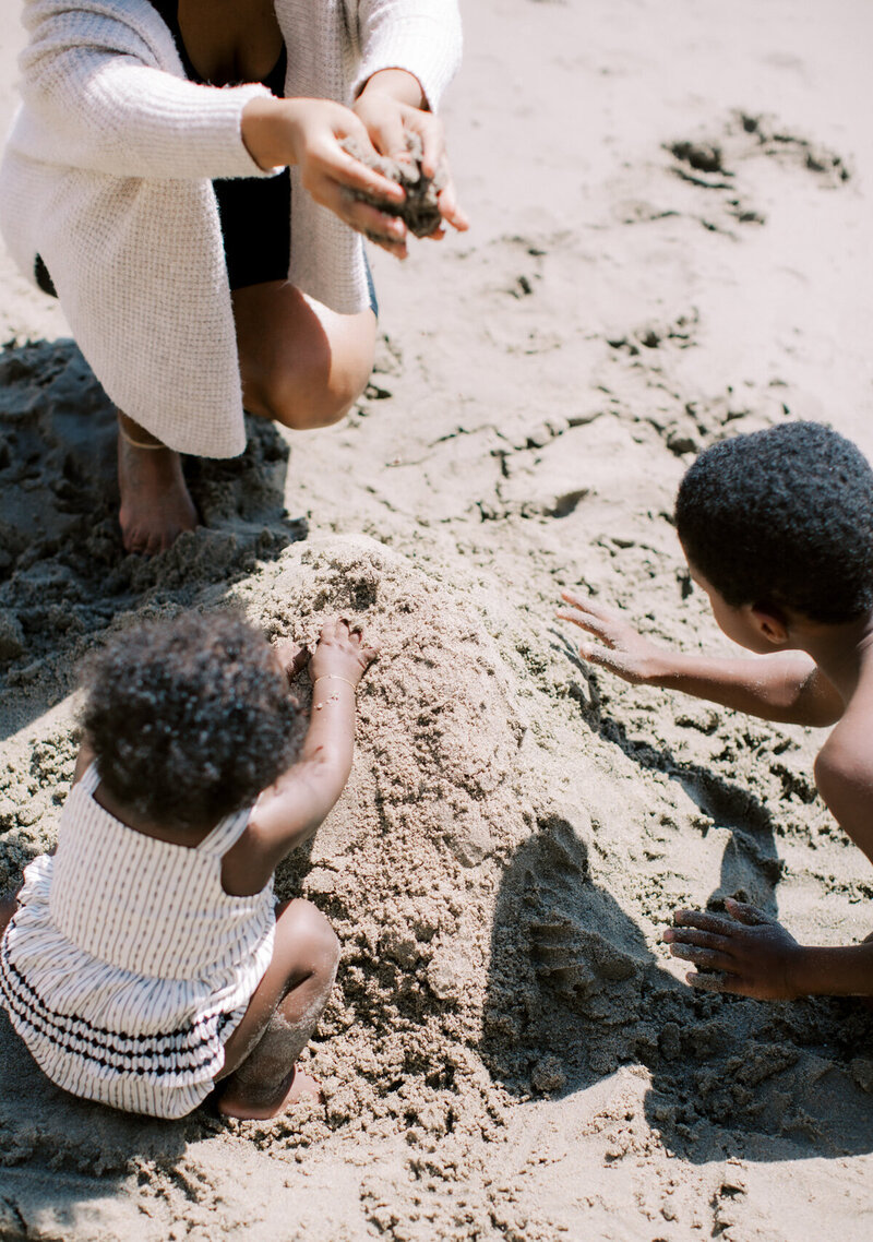 image of a woman on a beach with her two children on a website for therapy for Moms in Texas
