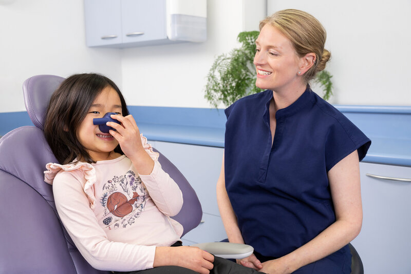 Happy and relaxed child in dental chair