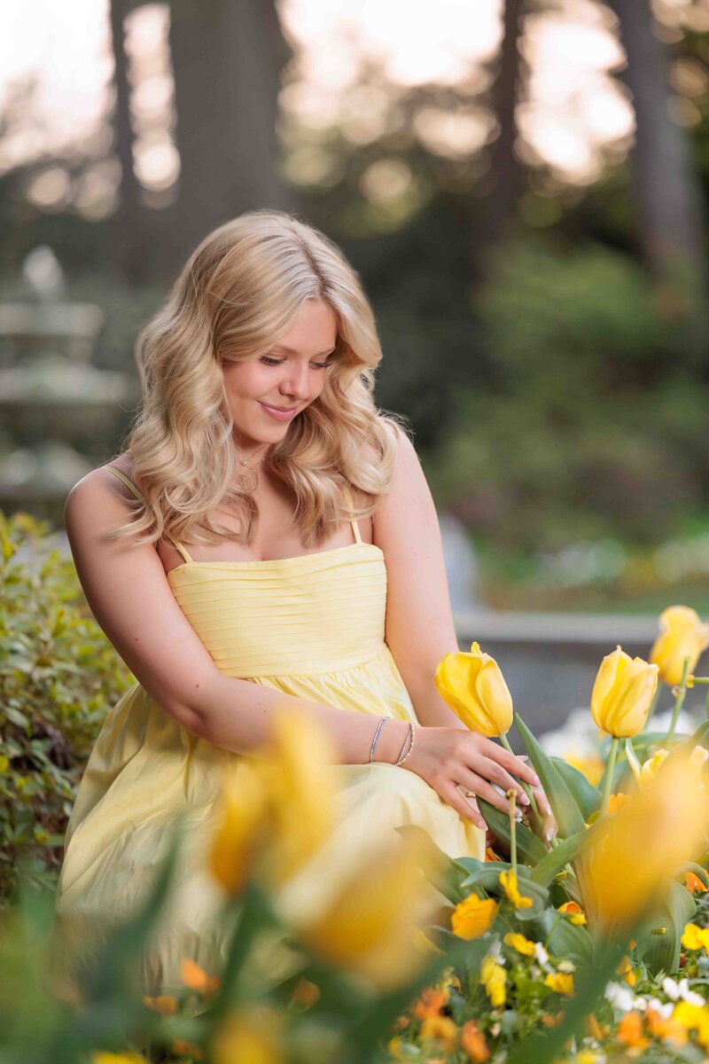 Teen Portraits with yellow tulips in Raleigh, NC.