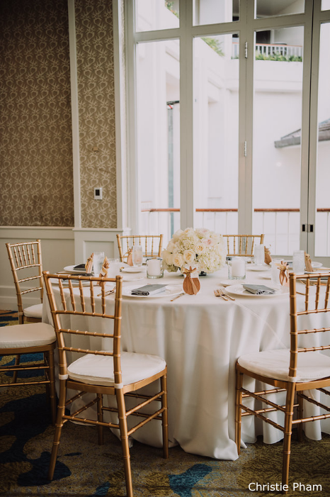 Gold chiavari chairs ivory matte satin linen Four Seasons Malolo