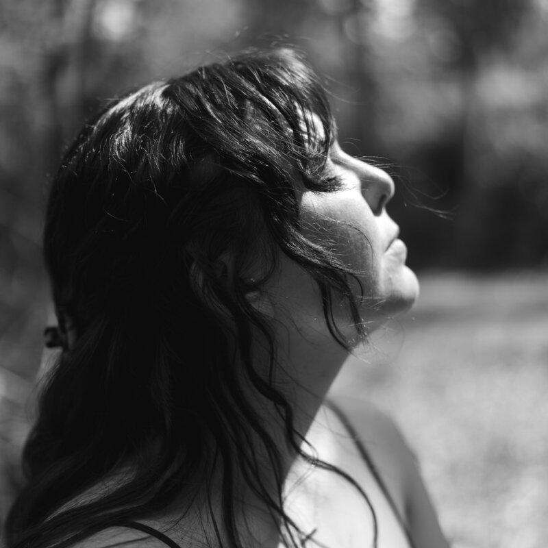 Portrait of Shannon, storytelling photographer, captured in her element with grounded presence