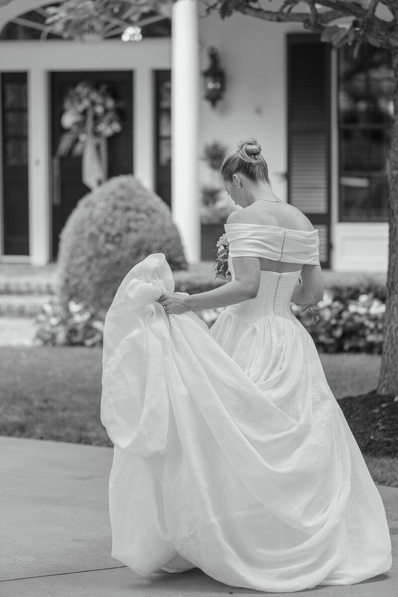 bride and groom twirling on blue checker dance floor at Mission Hills Country Club Kansas City wedding