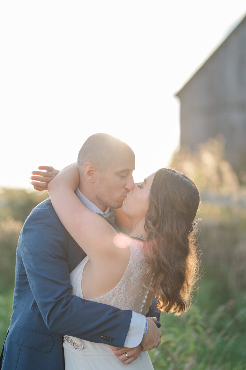 Wedding kiss at golden hour
