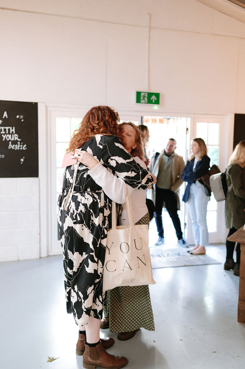 Woman posing whilst attendees photography her