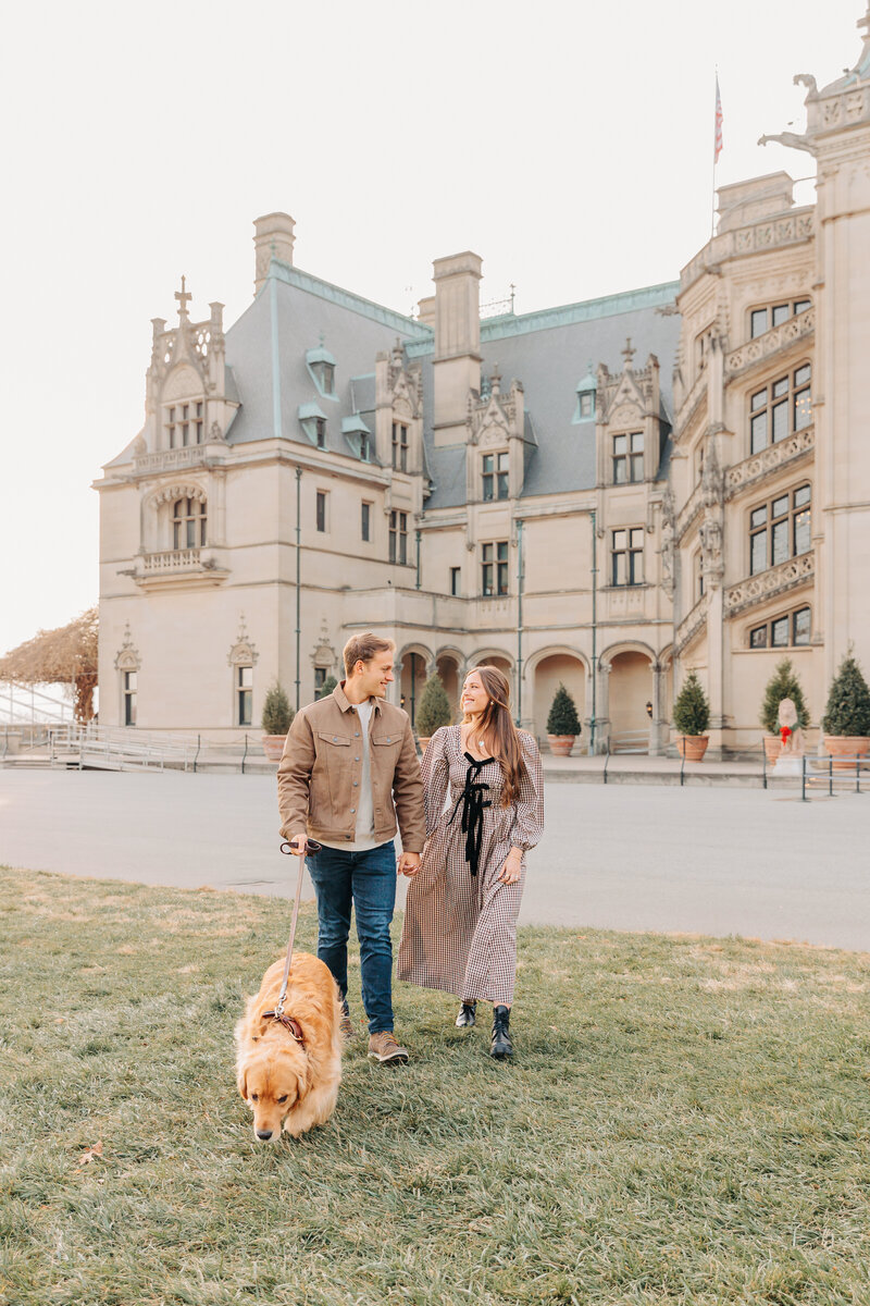 Biltmore Estate Couples Photographer photographs couple with their dog in Asheville, NC
