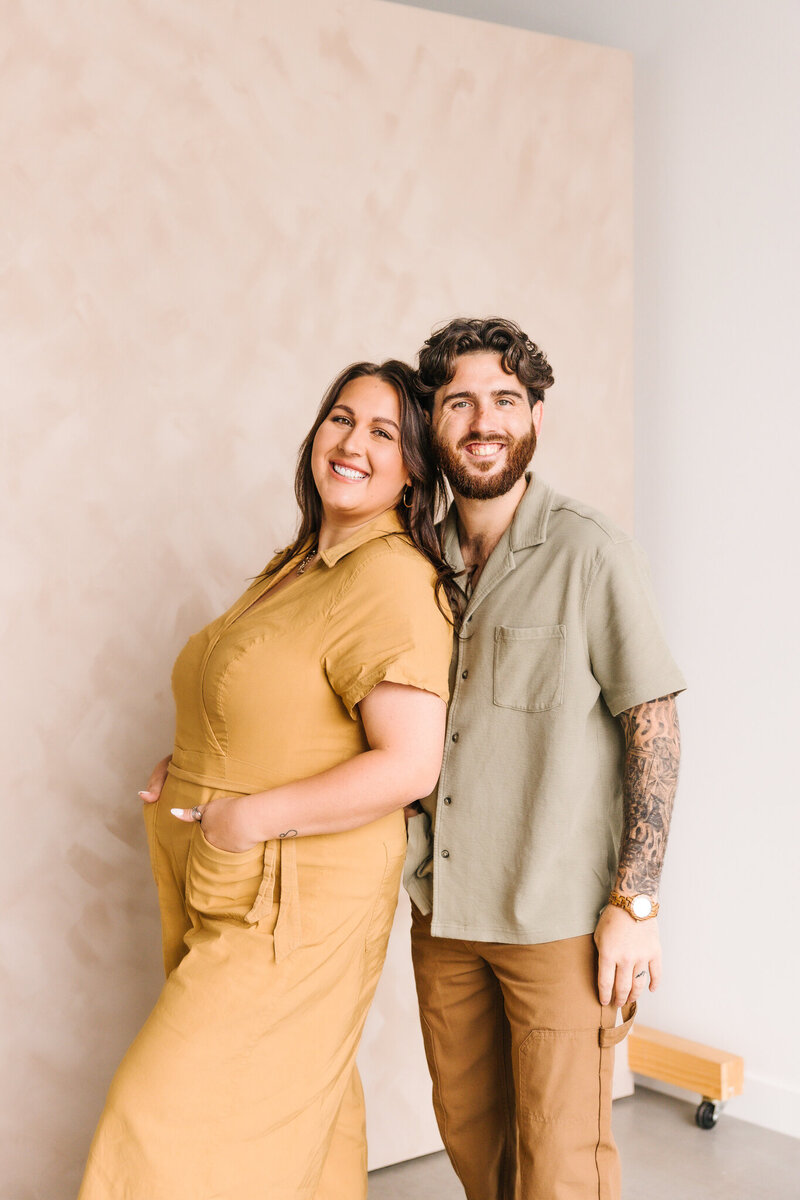 A person leaning back and smiling with their partner